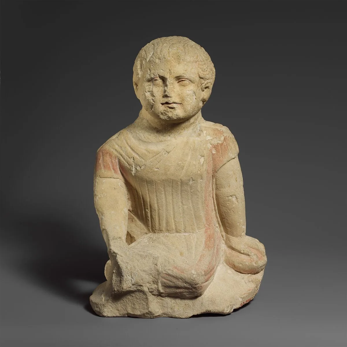 Limestone statuette of a temple boy — Unknown