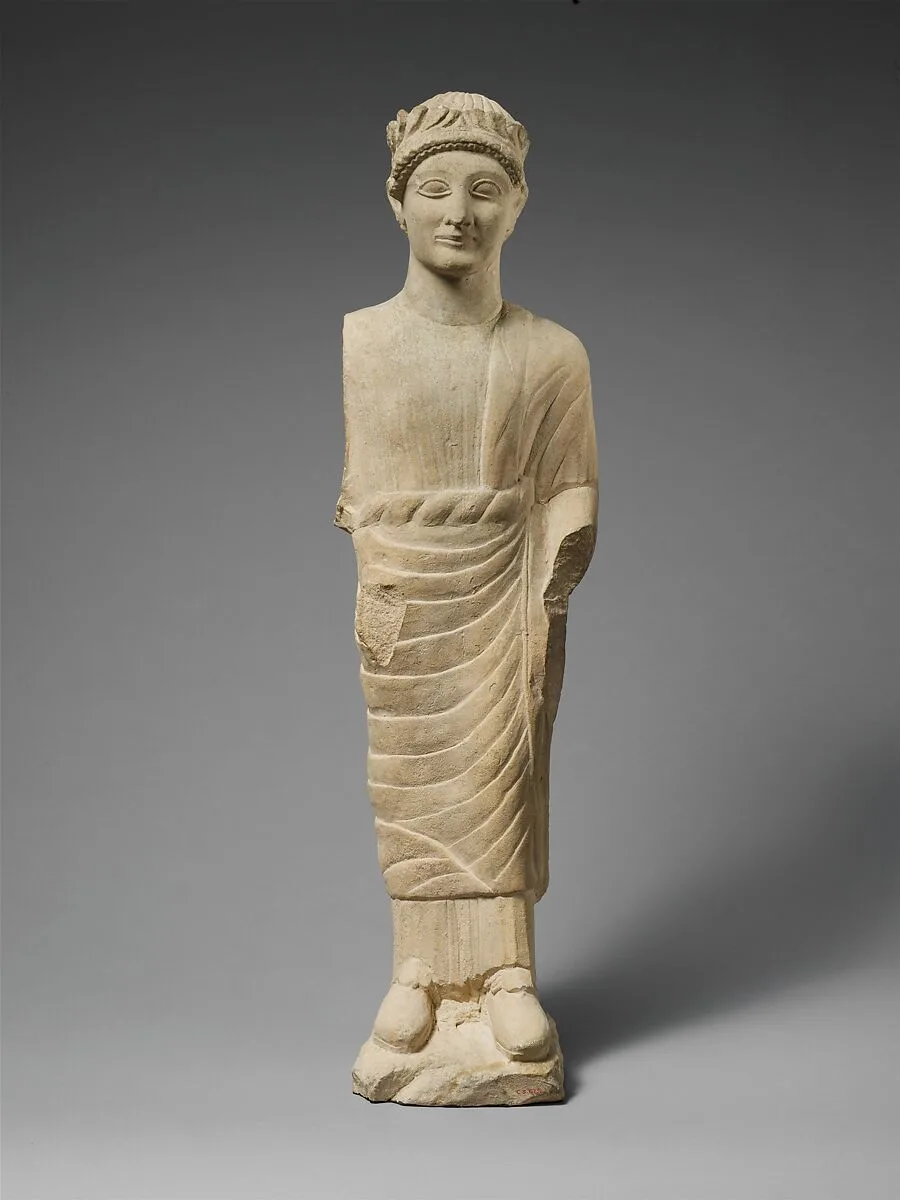 Limestone statuette of a beardless male votary with a wreath of leaves — Unknown