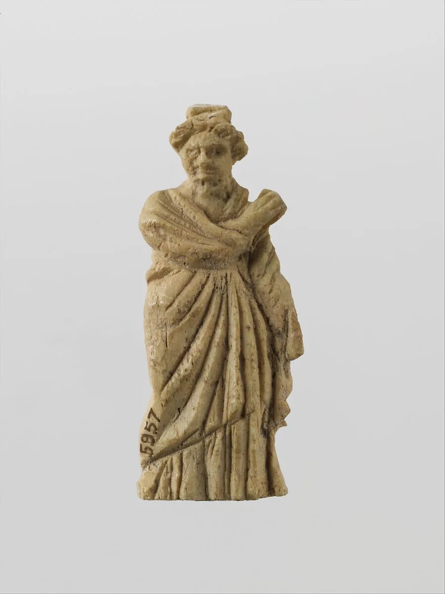 Bone statuette of a draped woman — Unknown