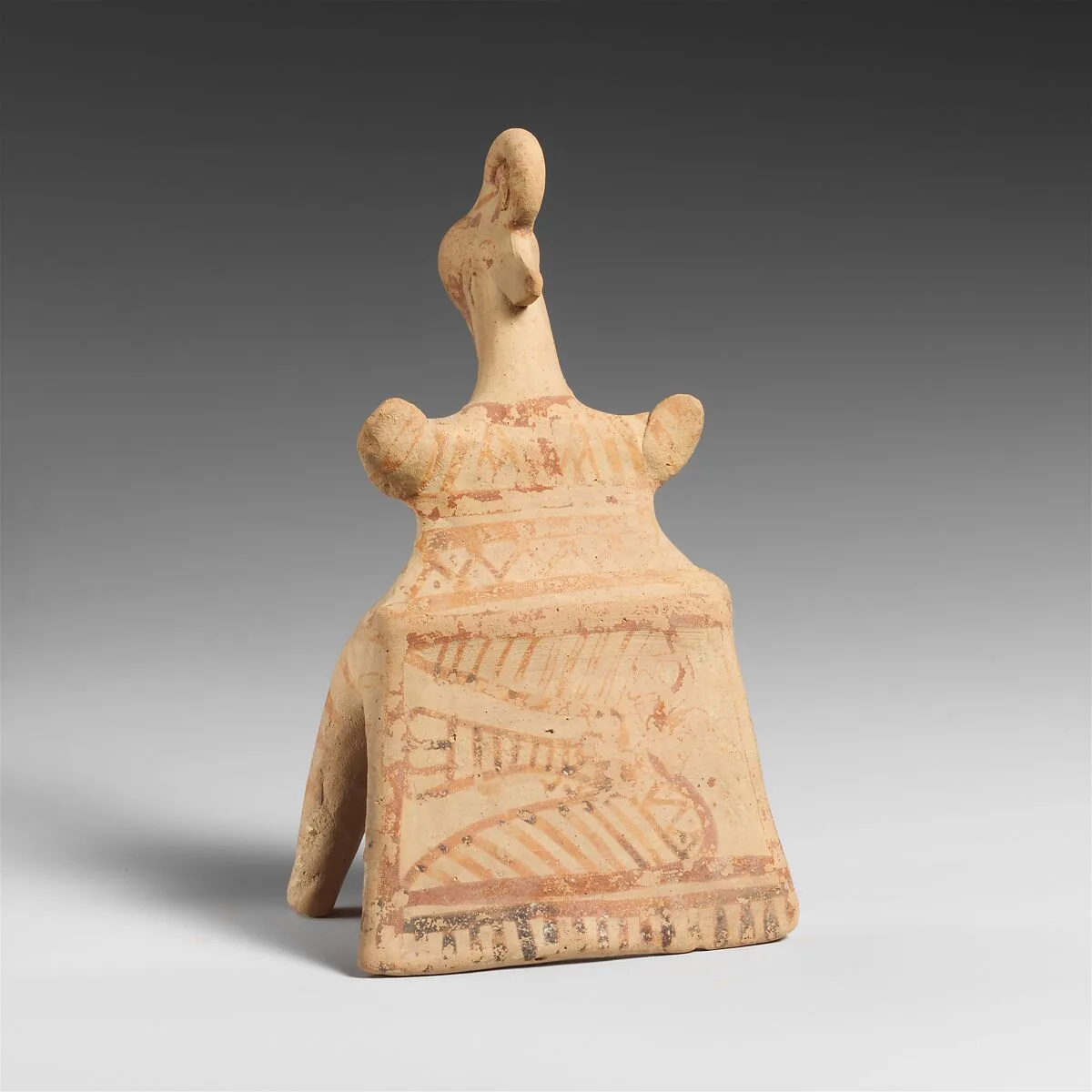 Terracotta statuette of a seated woman — Unknown