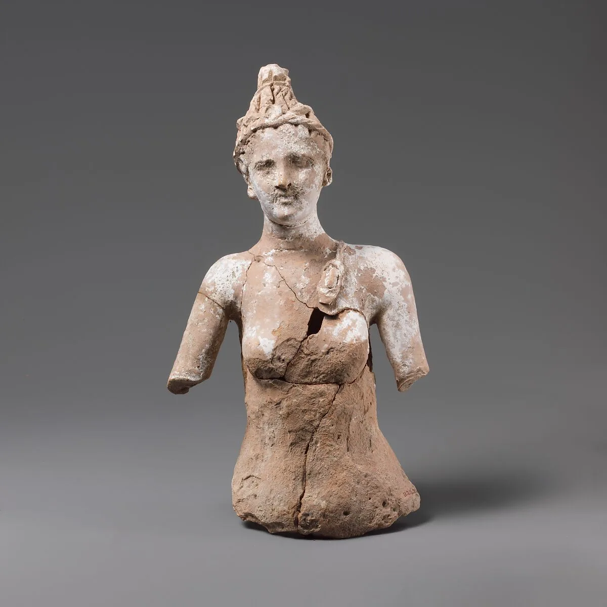 Fragmentary terracotta female statuette, perhaps Artemis — Unknown