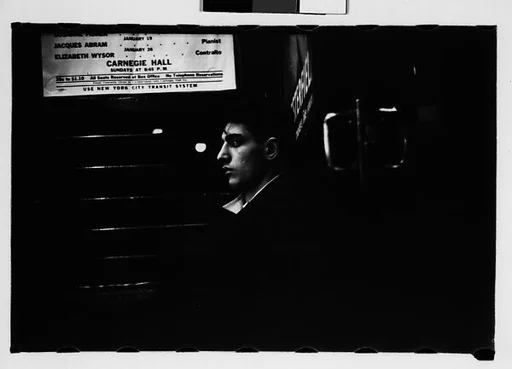 [Five 35mm Film Frames: Subway Passengers, New York City: Young Man and Man Wearing Hat in Car Corner]
