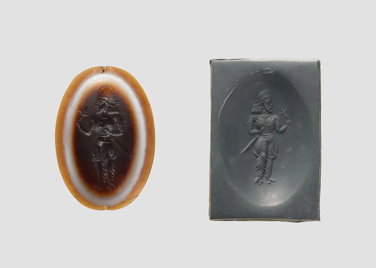 Stamp seal: standing noble holding a flower — Unknown