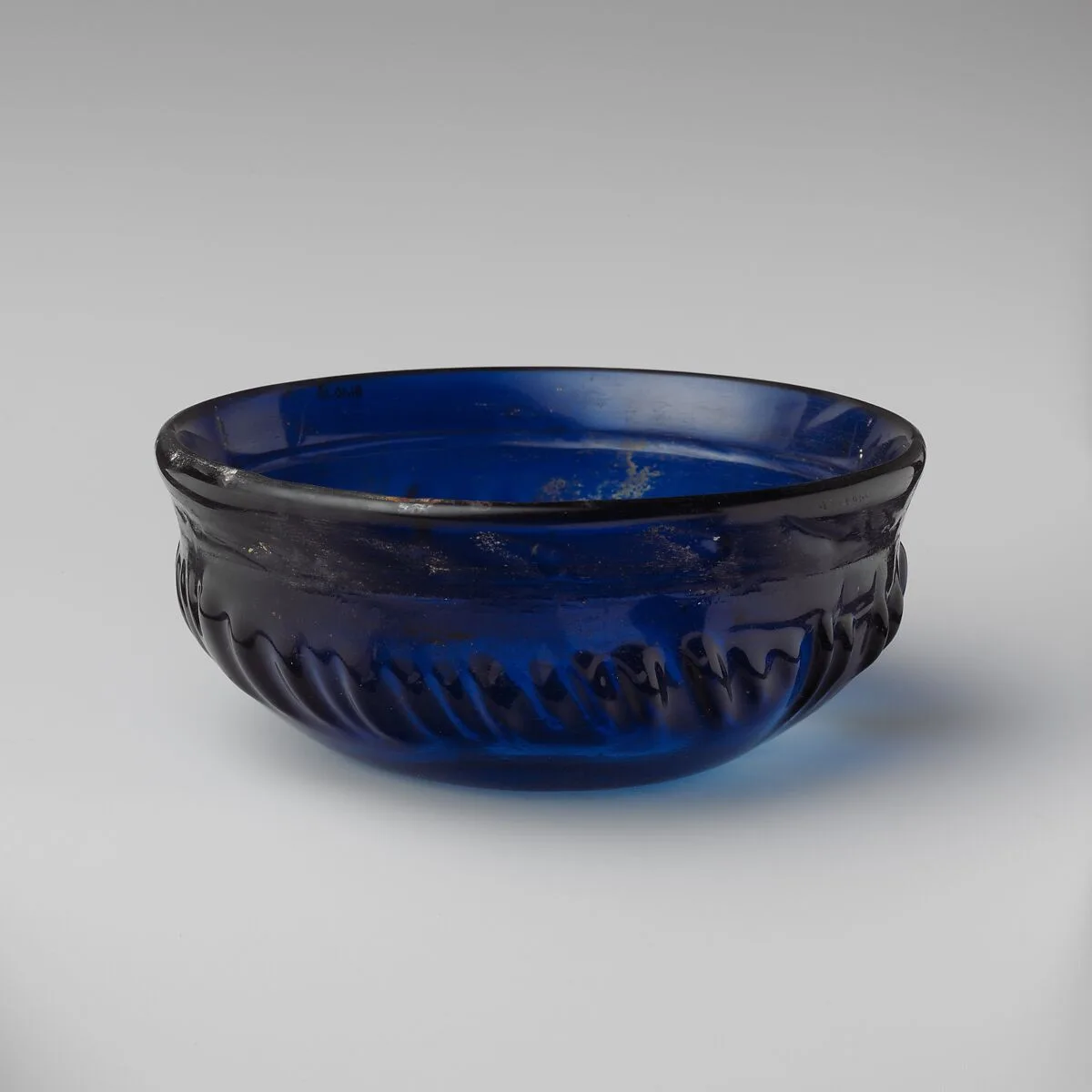 Glass ribbed bowl — Unknown