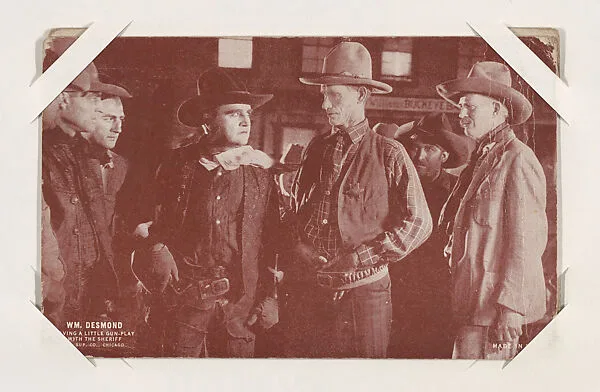 Wm. Desmond having a little gun-play with the sheriff from Western Stars or Scenes Exhibit Cards series (W412) — Unknown