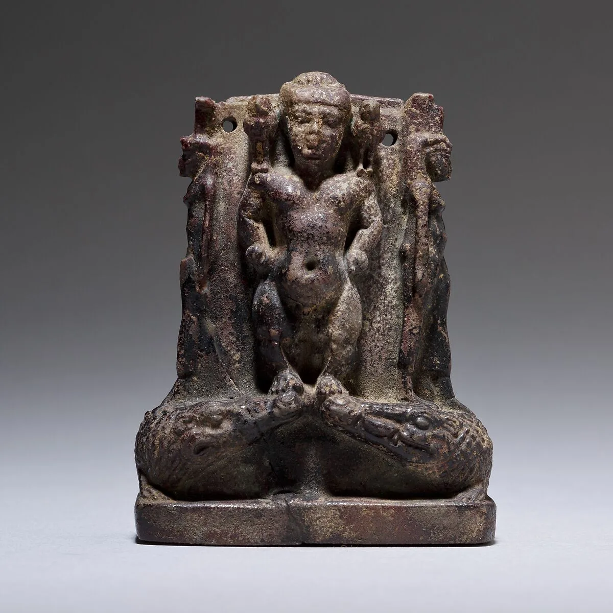 Cippus (magical stela) where Pataikos replaces Horus on the crocodiles and is flanked by Isis and Nephthys — Unknown