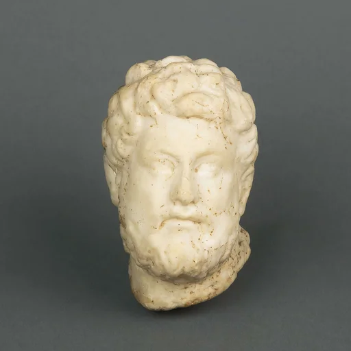 Marble statuette head of a bearded man