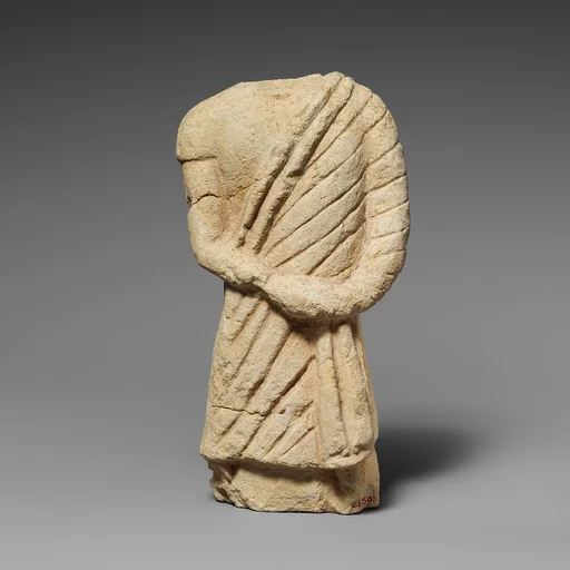 Fragment of a limestone statuette of a male votary