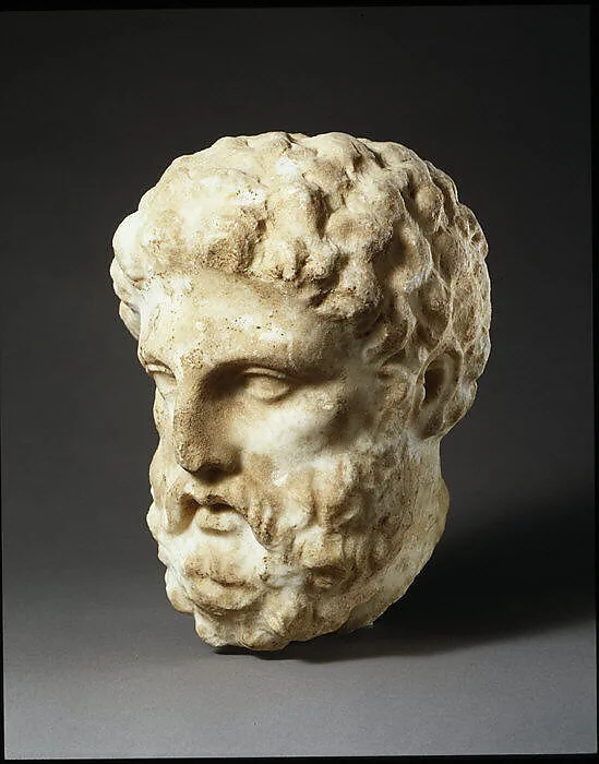 Marble head of a man from a grave stele — Unknown