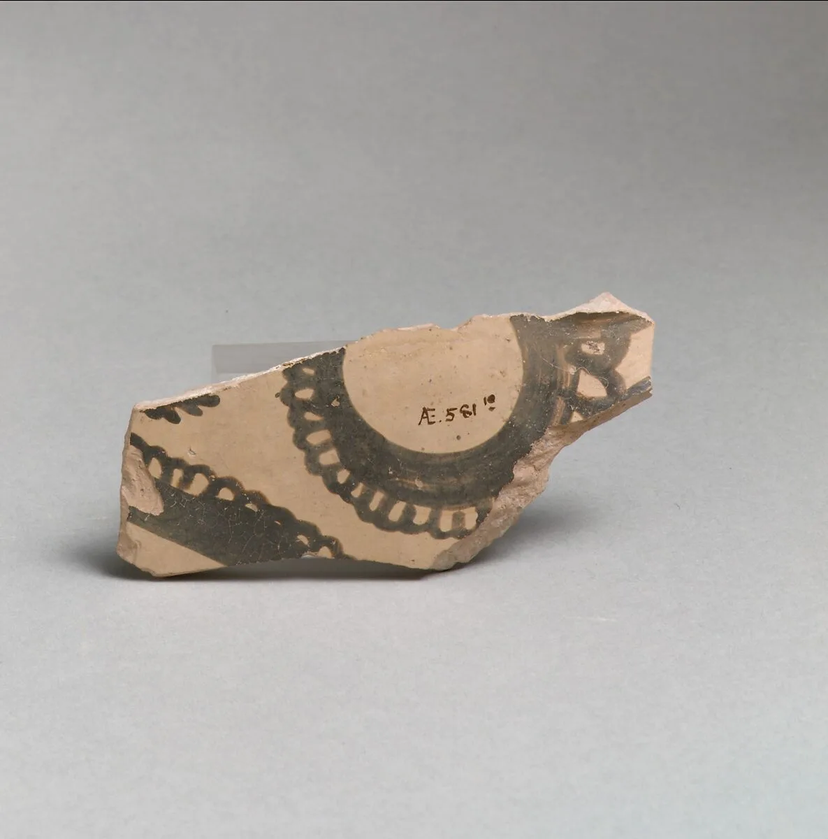 Terracotta vessel fragment with curvilinear decoration — Unknown