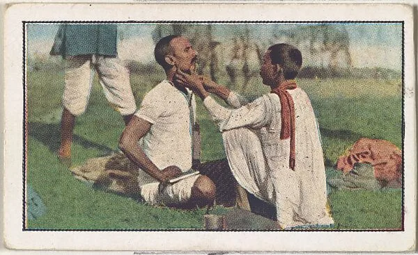 Card No. 207, Arrival of the Indian Troops in France–the Camp Barber, from the World War I Scenes series (T121) issued by Sweet Caporal Cigarettes — American Tobacco Company|Underwood & Underwood