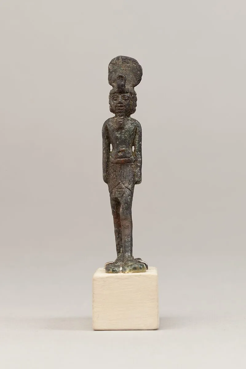 God wearing disk and uraeus on a short wig — Unknown