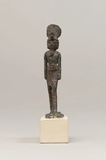 God wearing disk and uraeus on a short wig
