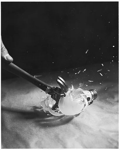 [Hammer Smashing Light Bulb]