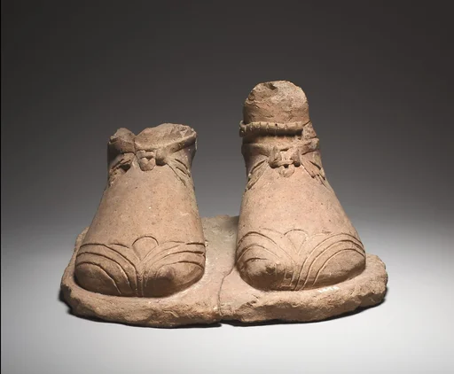 Feet on a plinth