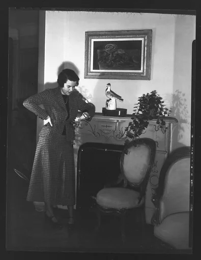 [Unidentified Woman Leaning on Fireplace Mantle]