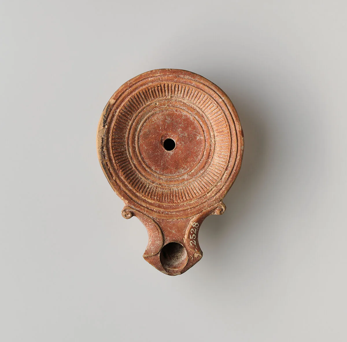 Terracotta oil lamp — Unknown