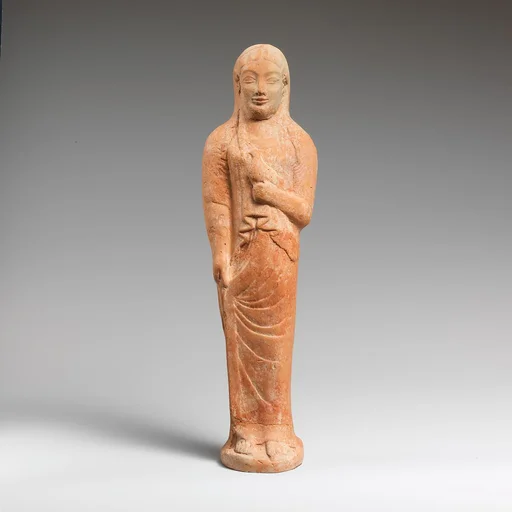 Terracotta statuette of a woman holding a bird