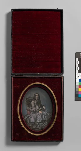 [Finely Dressed Woman Seated in Armchair]