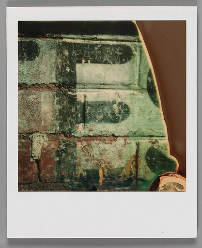 [Detail of Sign: "E"]