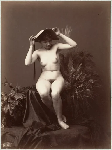 [Nude Woman with Hat in Studio]