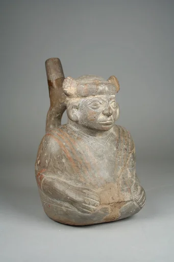 Stirrup Spout Bottle with Seated Figure