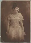 [Woman in White Dress]