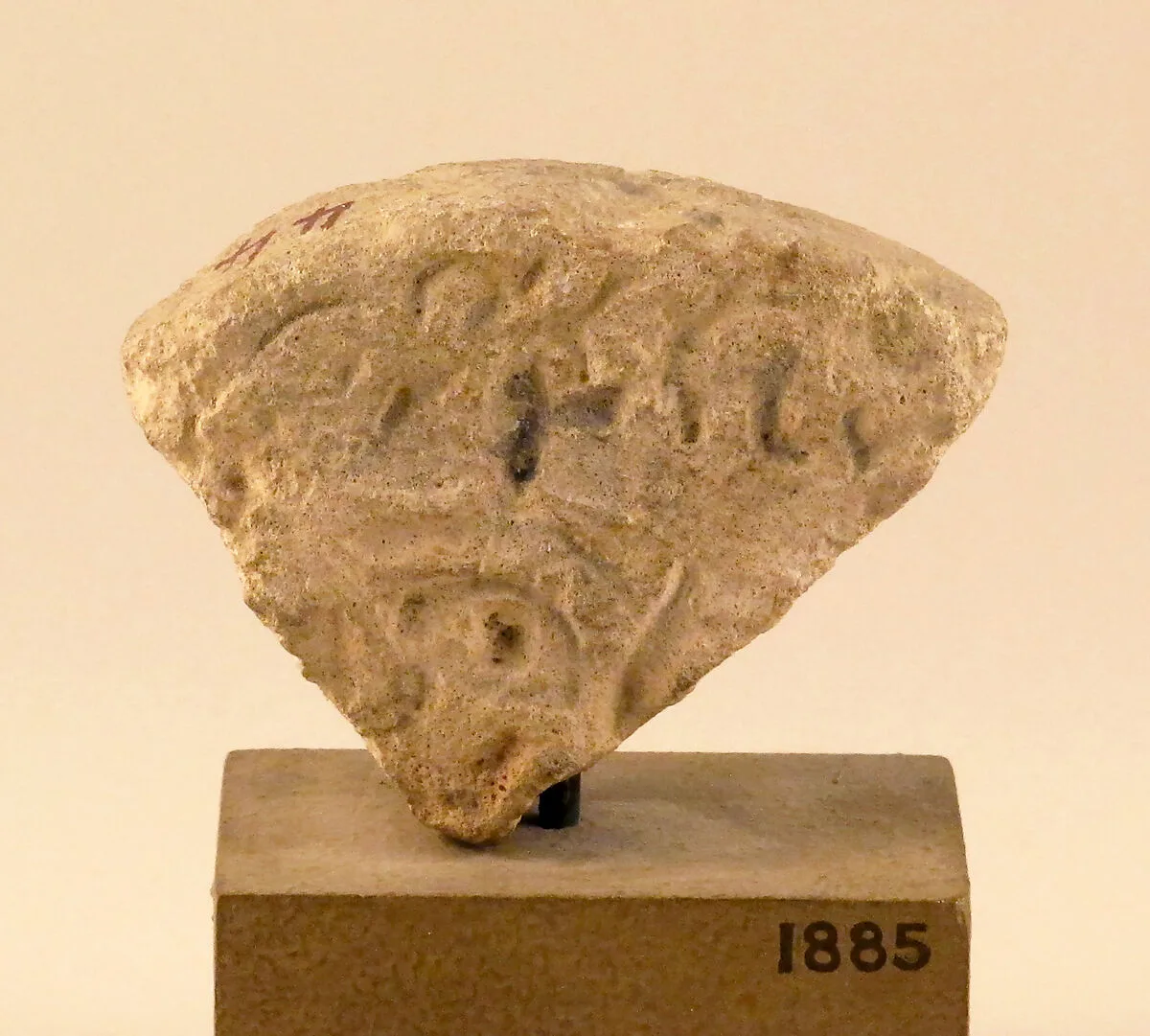Limestone inscribed disk fragment — Unknown