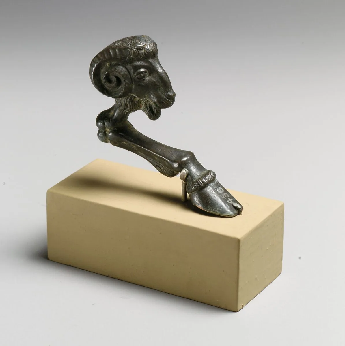 Bronze support in the form of a ram's head and foreleg — Unknown