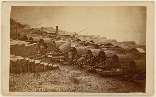 [Boats Along Riverbank]