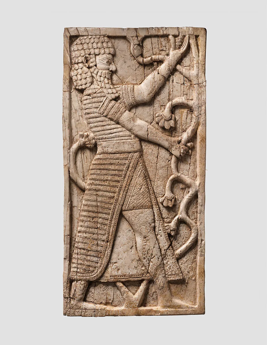 Furniture plaque carved in relief with striding man — Unknown
