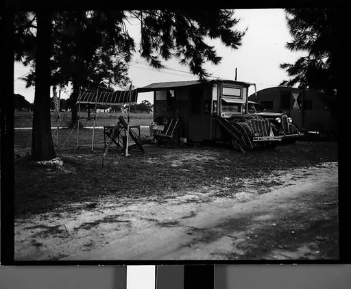 [Trailer with Canopy and Chairs in Camp, Florida]