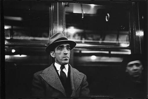 [Four 35mm Film Frames: Subway Passengers, New York City: Man in Hat and Overcoat, Older Man in Hat]