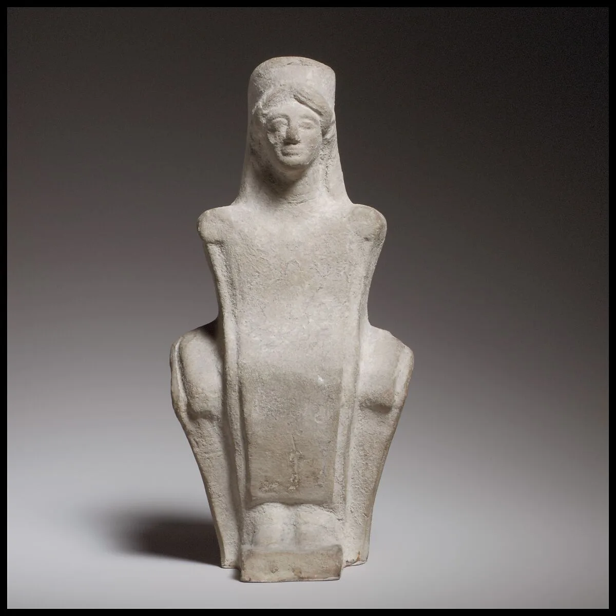 Seated female figurine — Unknown