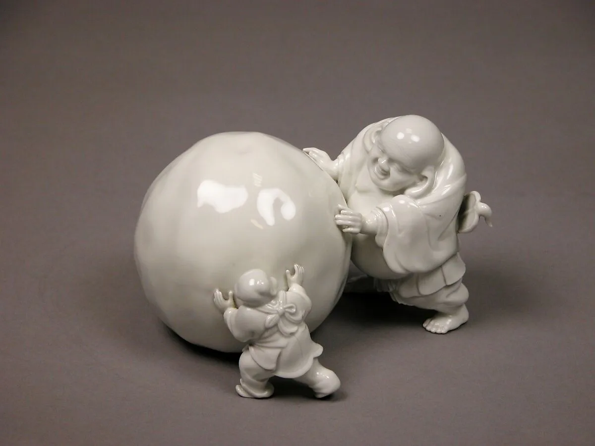 白磁布袋唐子雪玉形置物|Snowball Pushed by Hotei and a Child — Unknown