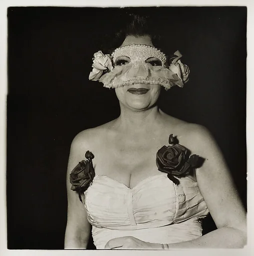 Lady at a masked ball with two roses on her dress N.Y.C.