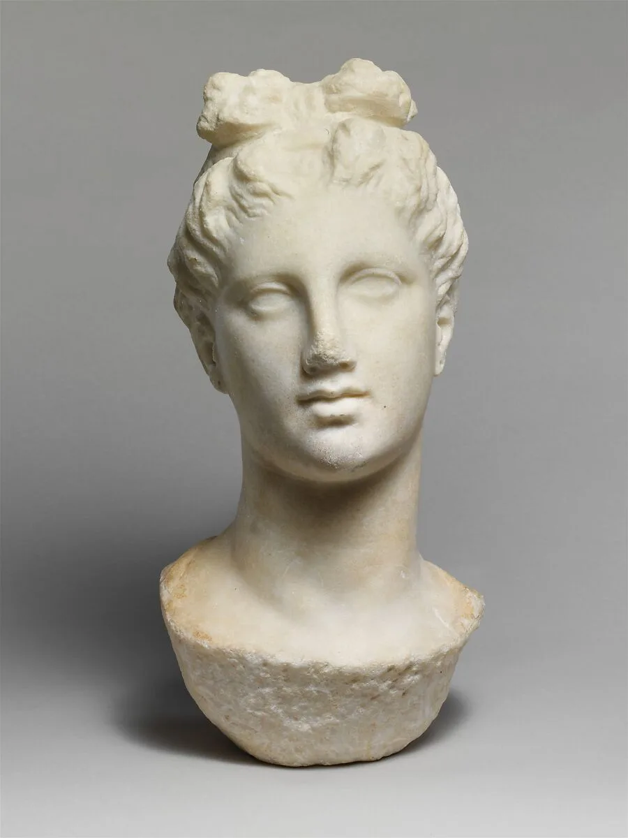 Marble head of a young woman from a funerary statue — Unknown