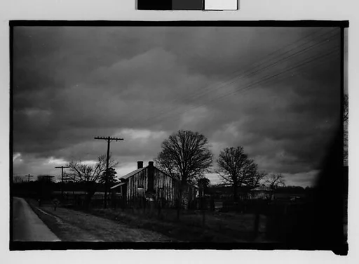 [Wooden House by Road, From Moving Car, Mobile, Alabama]