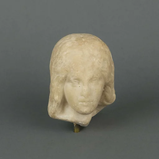 Marble head of a female statuette