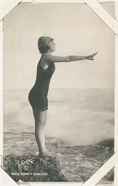 Bathing beauty posed to dive off rock from Mack Sennett Comedies Arcade series (W423) — Unknown