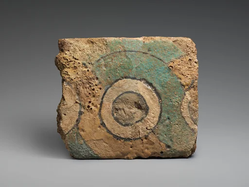 Brick fragment with a guilloche design