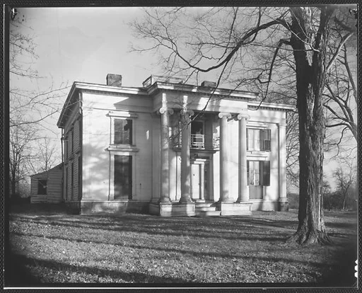 [Greek Revival House with Ionic Capitals and Full-Height Entry Porch]