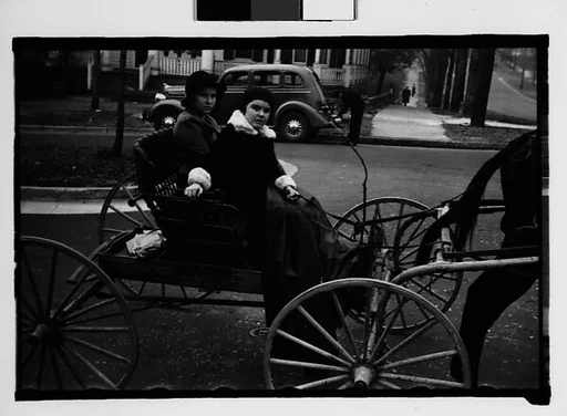 [Two Young Women in Horse-Drawn Carriage, Milledgeville, Georgia]