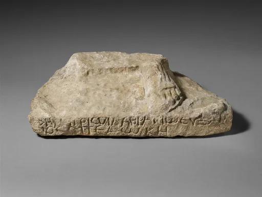 Inscribed limestone plinth of a statue of Zeus