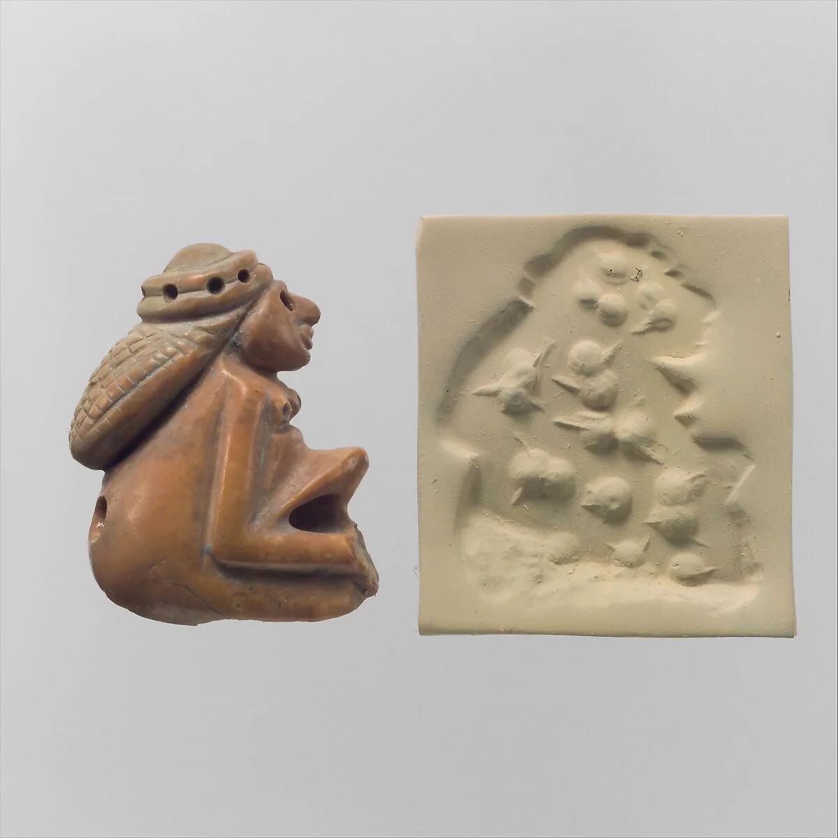 Seal amulet in the form of a seated female and modern impression — Unknown