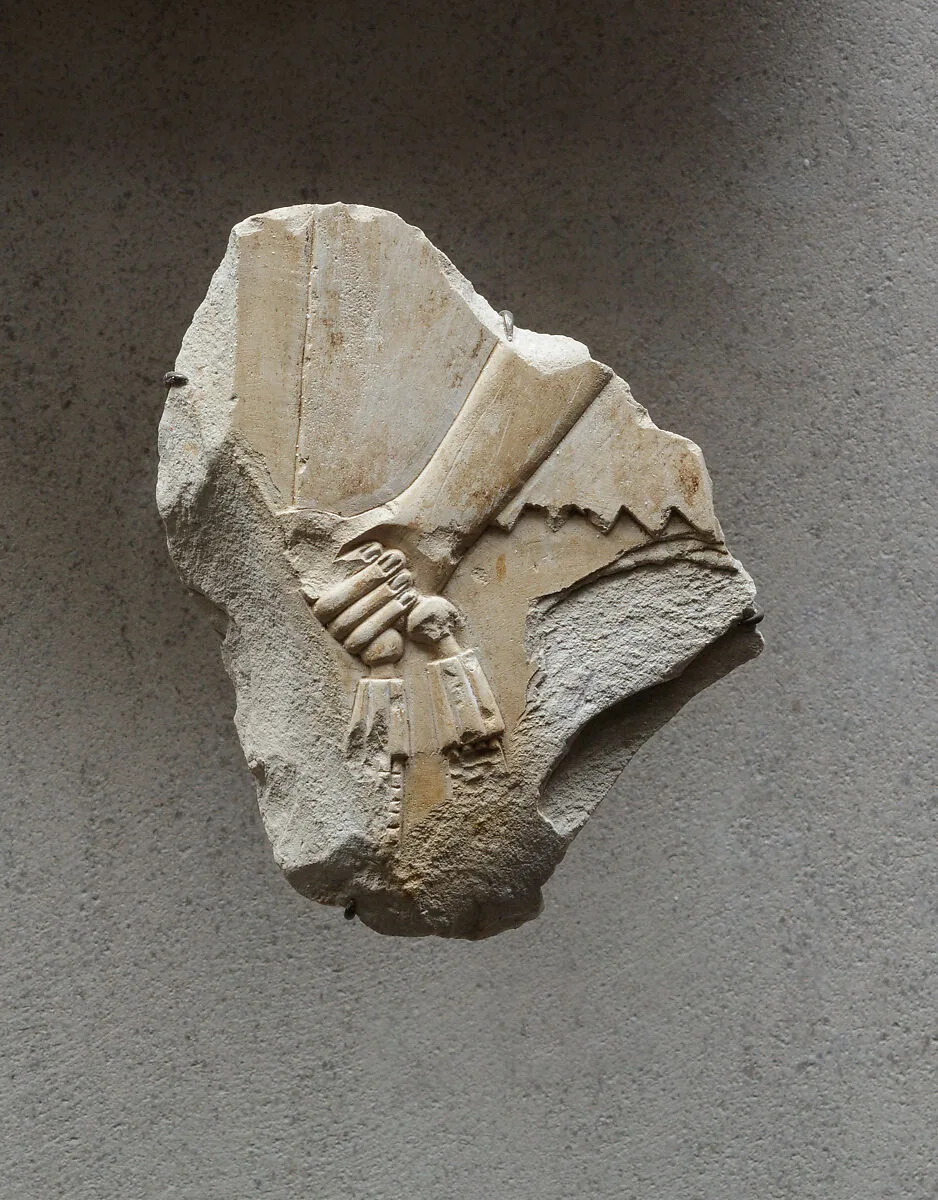 Relief of an attendant's hand holding a necklace - see 26.3.353-3 — Unknown