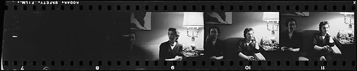[Three 35mm Film Frames:  Portraits of Two Unidentified Women at Party]