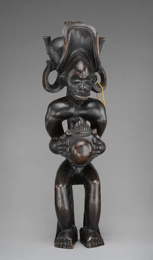 Seated Chief (Mwanangana) Playing Sanza