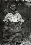 Woman outdoors – Ewe kente skirt, headtie and blouse — Alex Agbaglo Acolatse