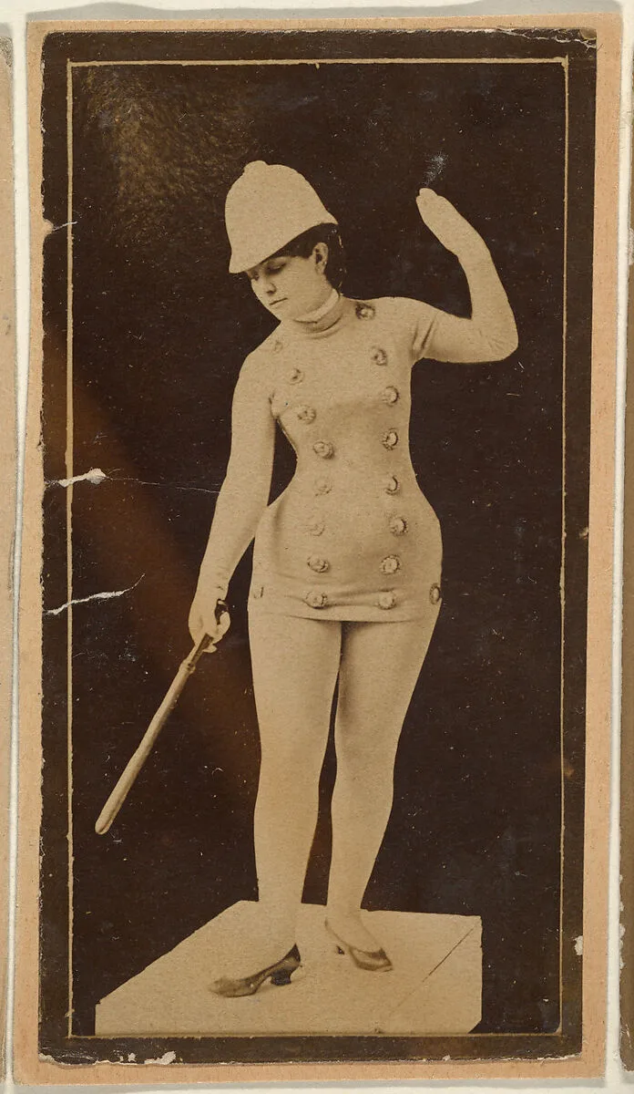 Actress wearing policeman costume with baton and cap, from the Actresses series (N668) — Unknown